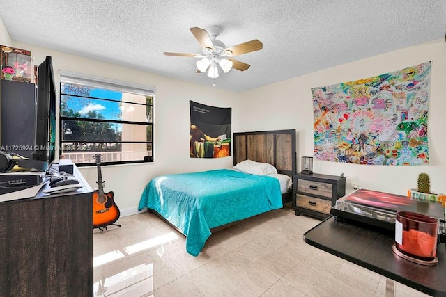 bedroom featuring a textured ceiling and ceiling fan