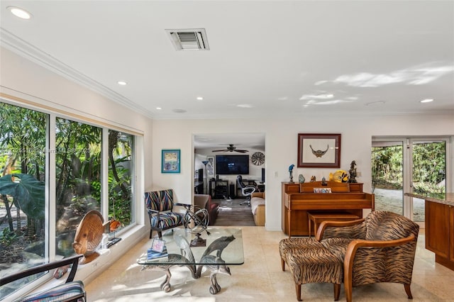 tiled living room featuring crown molding and plenty of natural light