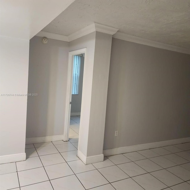 interior space featuring a textured ceiling and light tile patterned floors