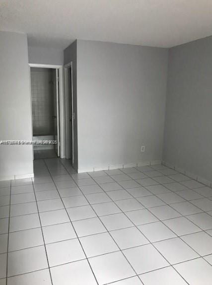 empty room featuring light tile patterned flooring