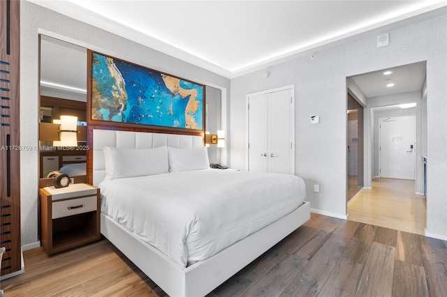 bedroom with wood-type flooring