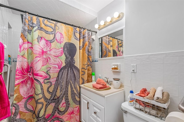 bathroom with tile walls, toilet, and walk in shower