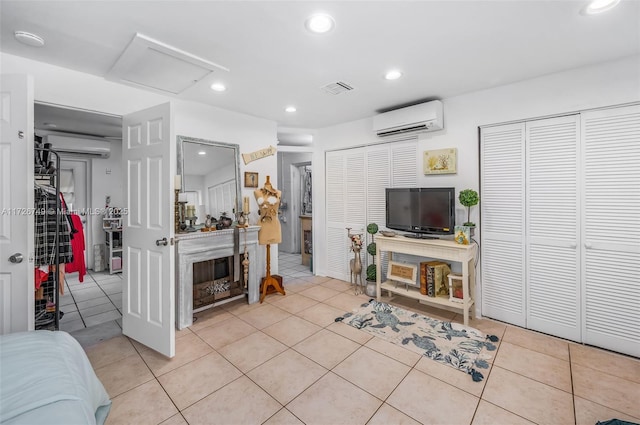 tiled living room with a wall mounted AC