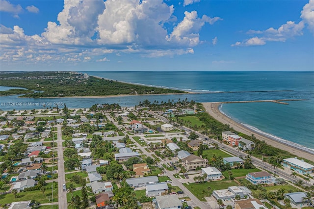 drone / aerial view featuring a view of the beach and a water view