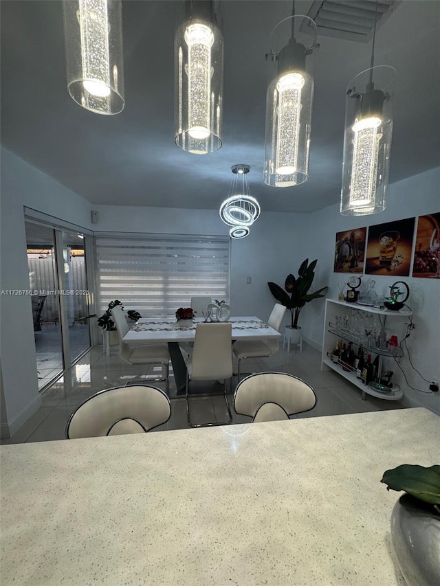 dining room with tile patterned floors