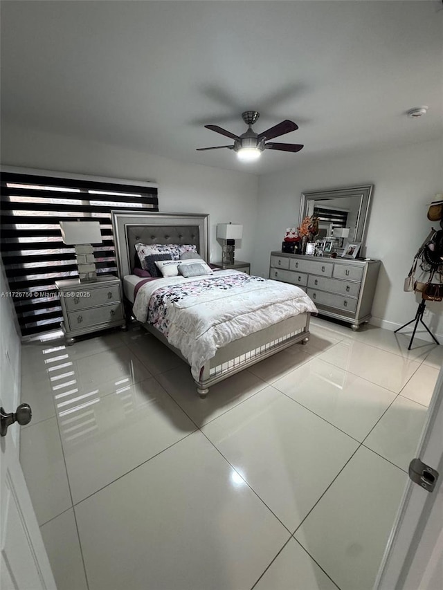 tiled bedroom with ceiling fan