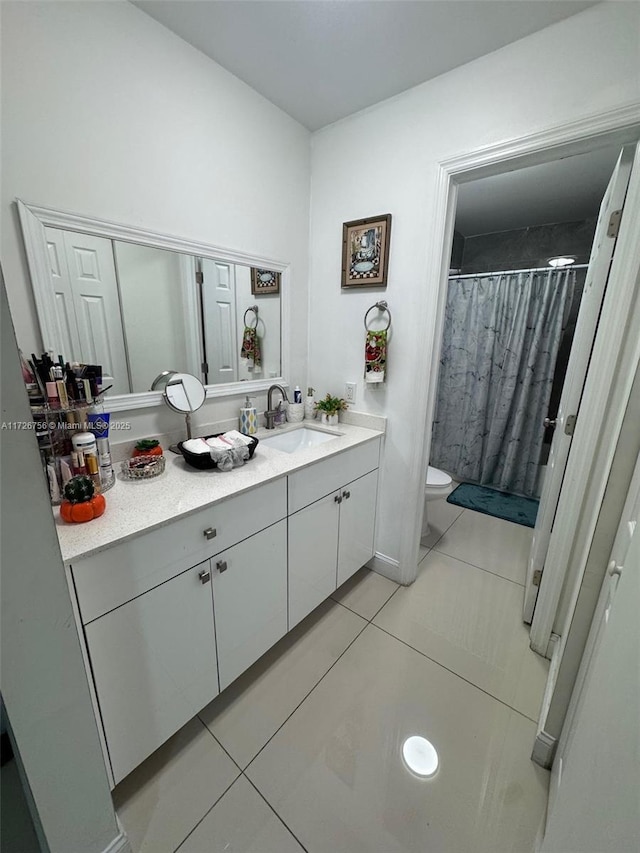 bathroom with vanity, tile patterned flooring, curtained shower, and toilet