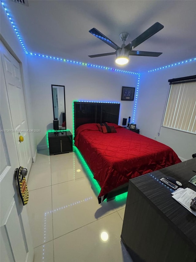 bedroom with tile patterned floors and ceiling fan