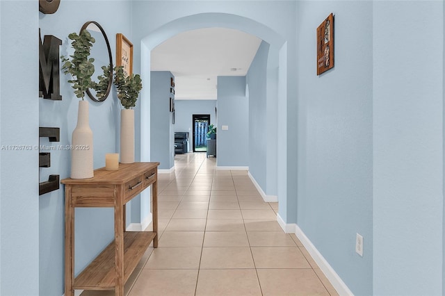 hall with light tile patterned floors