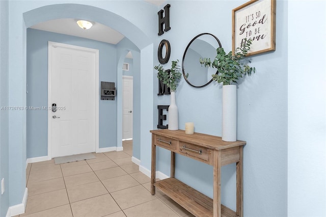 hallway with light tile patterned flooring