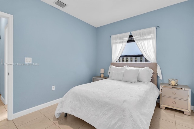 bedroom featuring light tile patterned floors