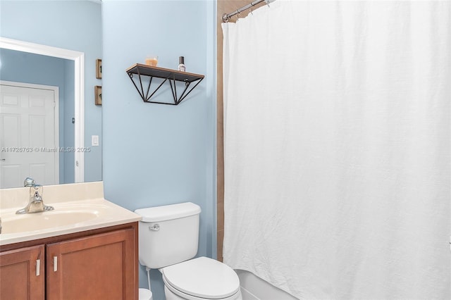 bathroom featuring toilet and vanity