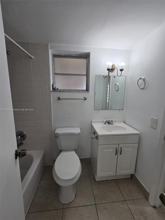 full bathroom with toilet, vanity, tiled shower / bath combo, and tile patterned flooring