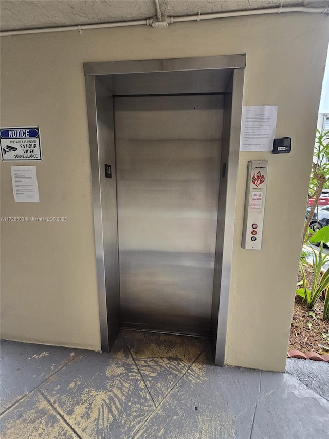 entrance to property featuring elevator