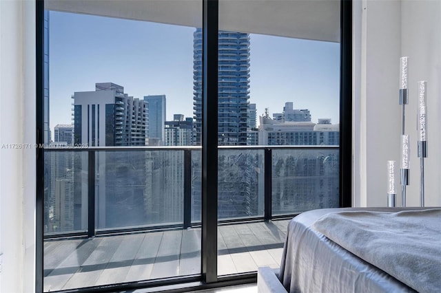 bedroom featuring a wall of windows and multiple windows