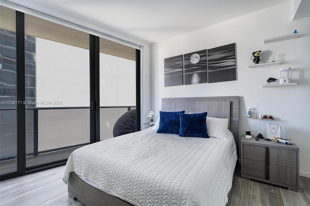 bedroom featuring wood finished floors