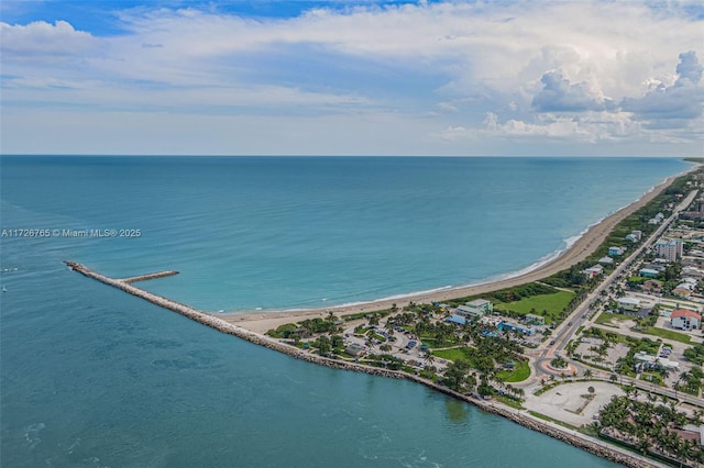 aerial view featuring a view of the beach and a water view