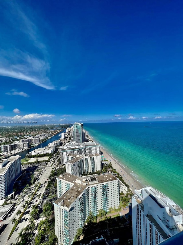 aerial view with a beach view and a water view