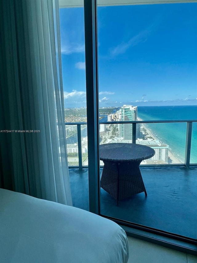 bedroom featuring a water view