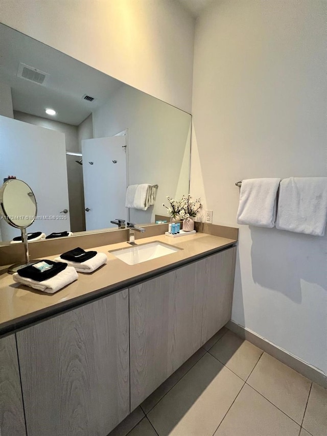 bathroom with vanity and tile patterned floors