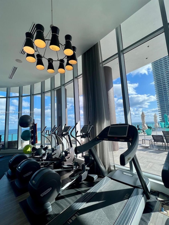 gym featuring a water view