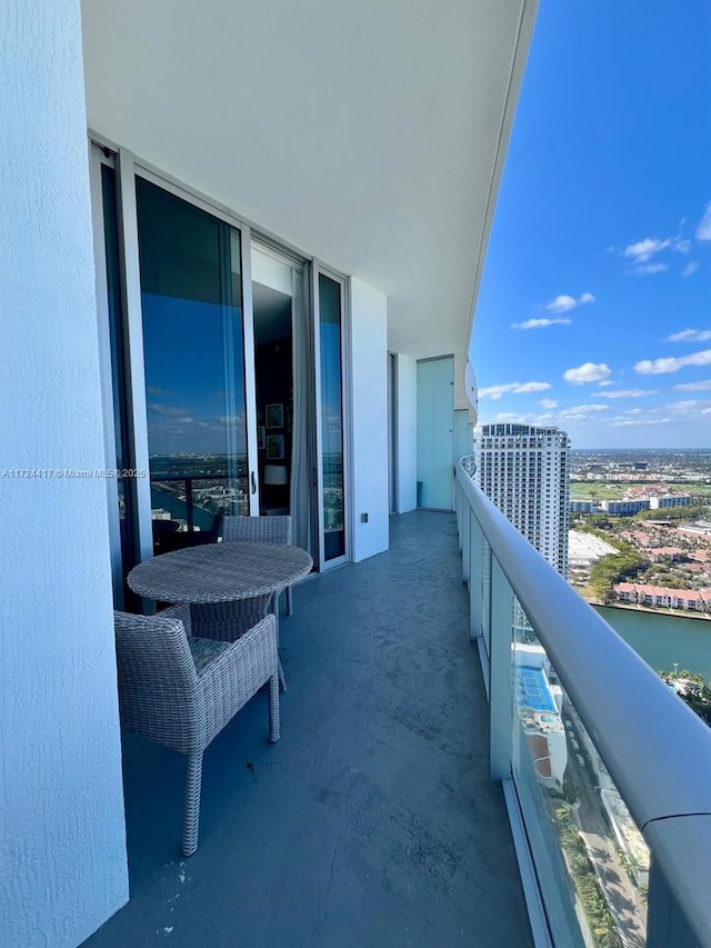 balcony featuring a water view