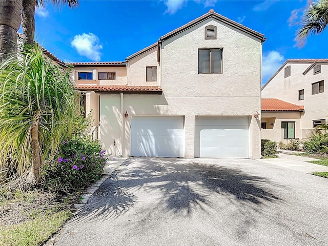 mediterranean / spanish-style house featuring a garage