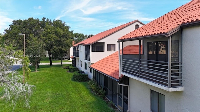 view of home's exterior featuring a lawn