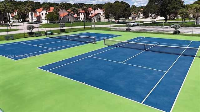 view of sport court featuring basketball hoop