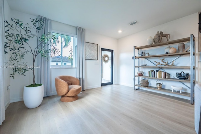 sitting room with light hardwood / wood-style floors