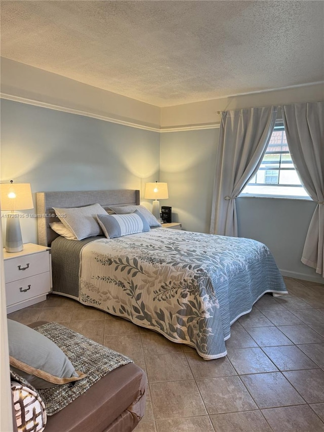 tiled bedroom with a textured ceiling