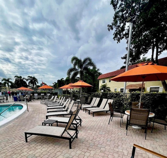 view of patio with a community pool