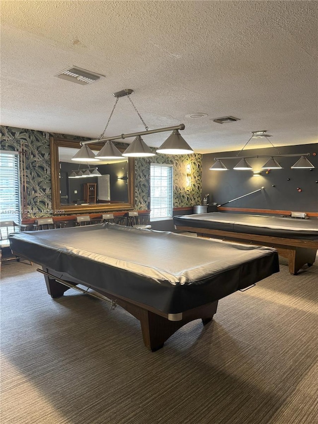 rec room with a textured ceiling and pool table