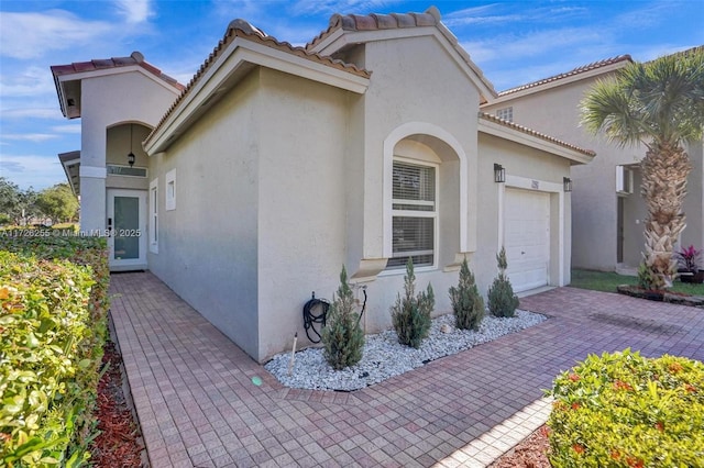 view of property exterior with a garage