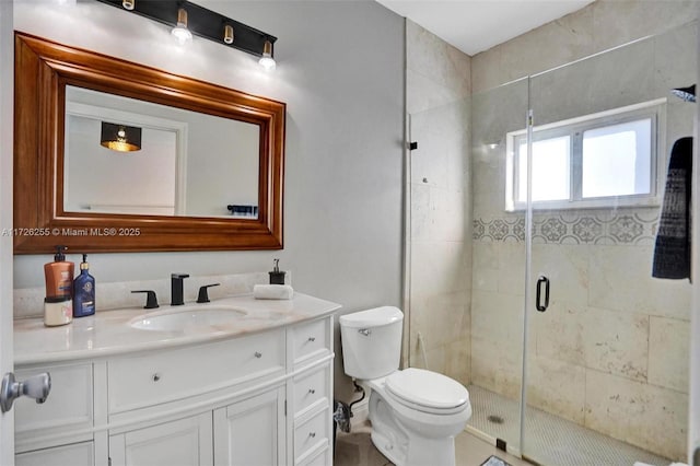 bathroom with a shower with door, toilet, and vanity