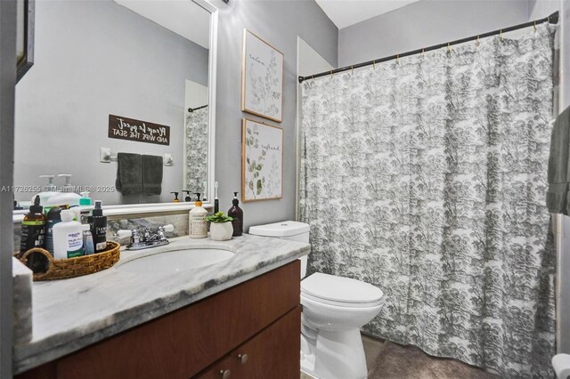 bathroom with toilet and vanity