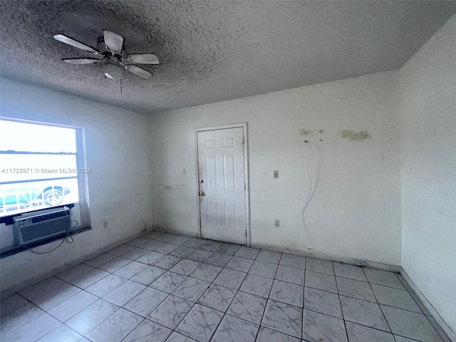 empty room with a textured ceiling, ceiling fan, and cooling unit