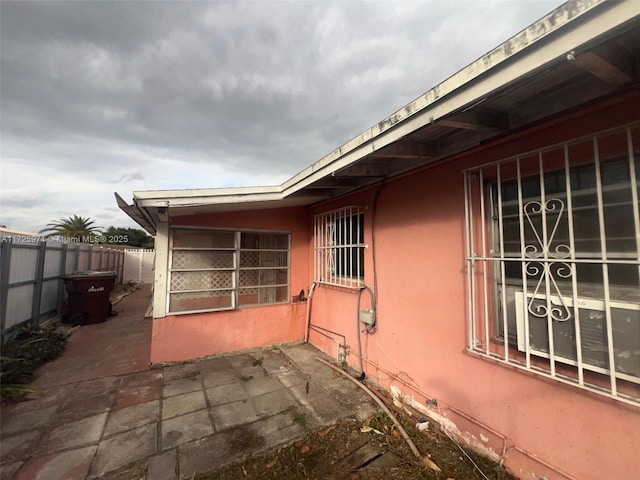 view of side of home featuring a patio area