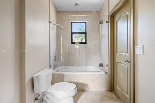 bathroom with toilet and enclosed tub / shower combo