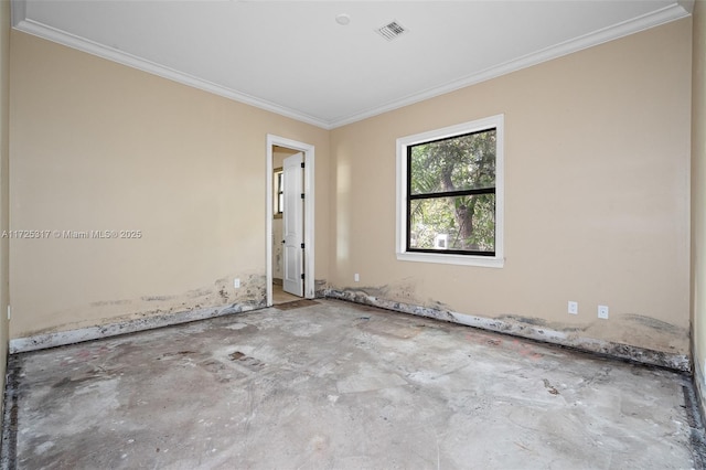 unfurnished room featuring ornamental molding