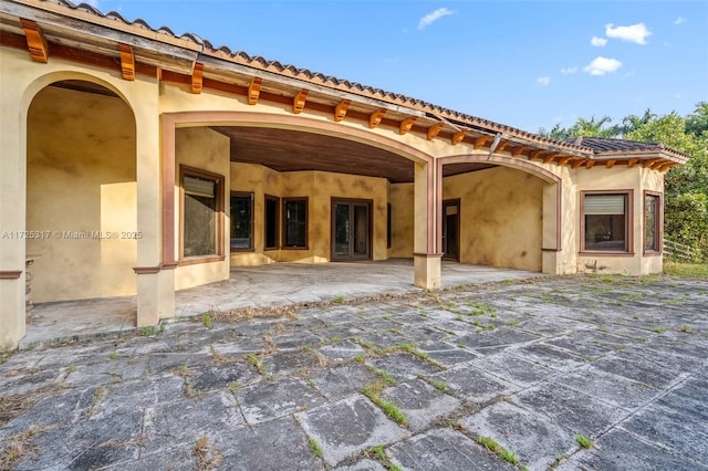 rear view of property with a patio area