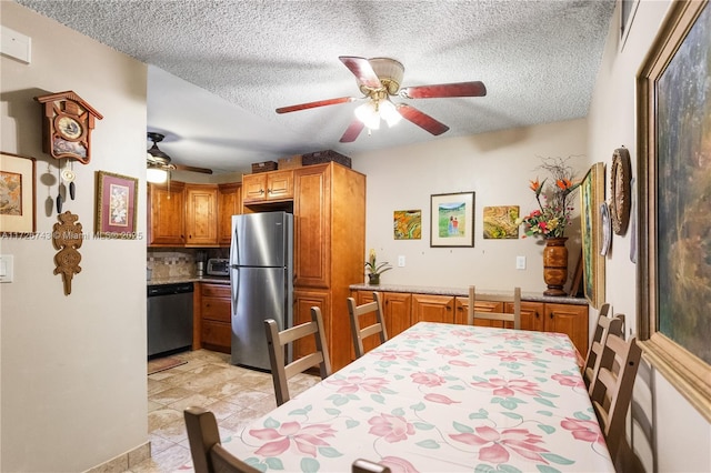 interior space featuring a textured ceiling and ceiling fan