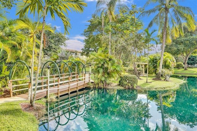 view of swimming pool featuring a water view