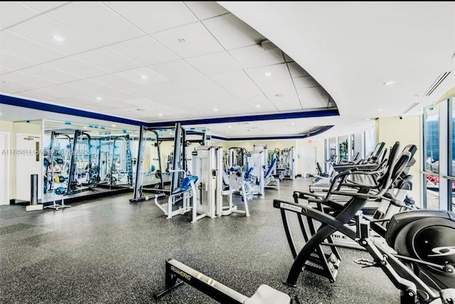 exercise room featuring a drop ceiling