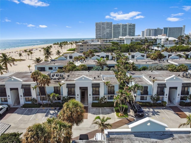 birds eye view of property with a view of the beach and a water view