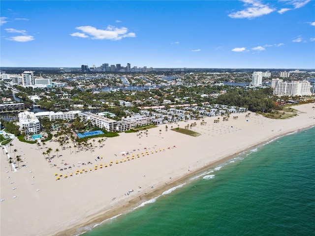 bird's eye view featuring a beach view and a water view