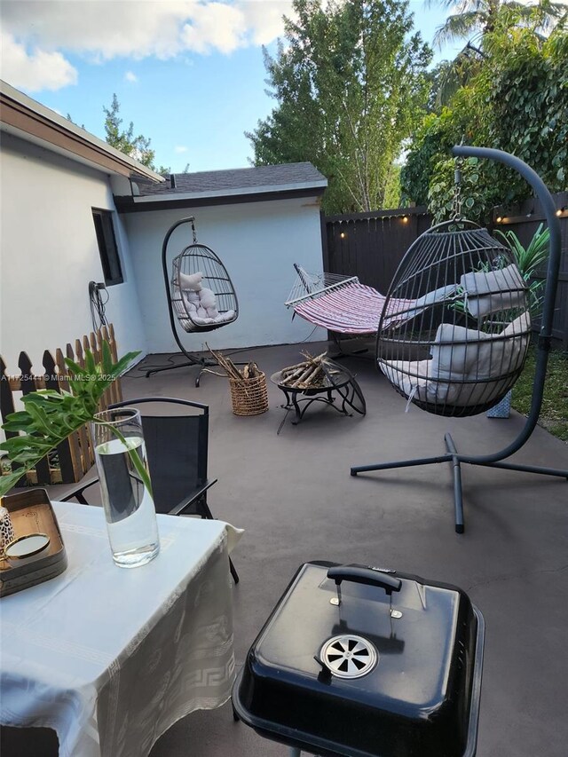 view of patio / terrace with an outdoor fire pit