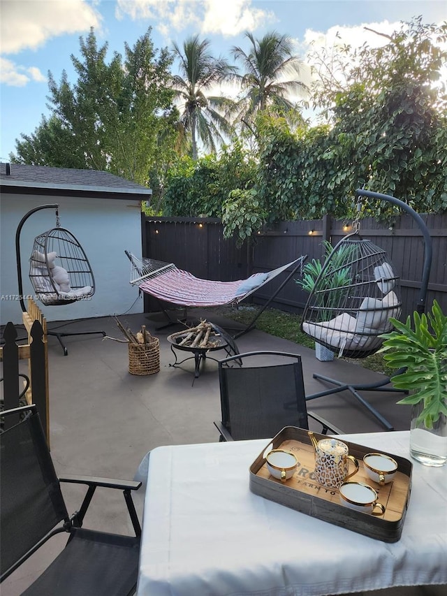 view of patio / terrace featuring a fire pit