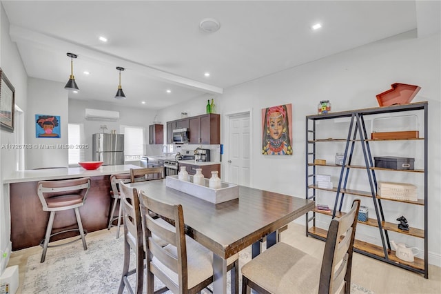 dining room featuring an AC wall unit and beam ceiling