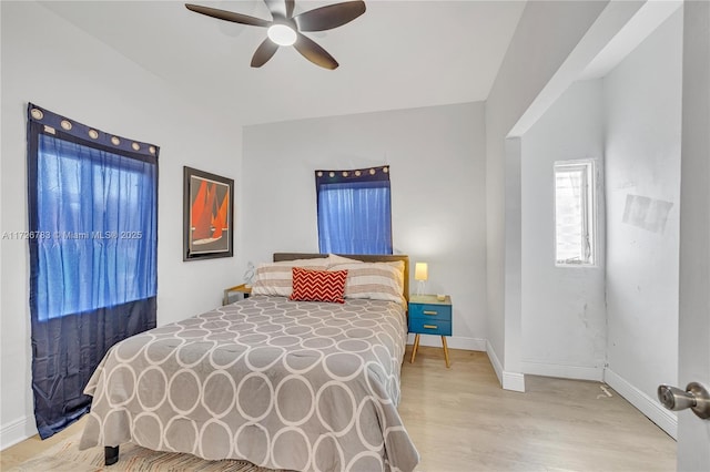 bedroom featuring ceiling fan and light hardwood / wood-style flooring